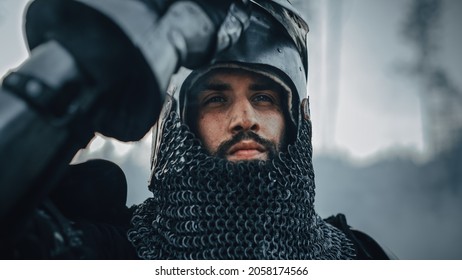 Medieval Knight on Battlefield, Looking at Camera, his Helmet is Open. Portrait of Mighty Warrior, King, Soldier at War, Conquest, Crusade. Dramatic Scene, Cinematic Historic Reenactment