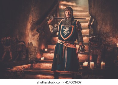 Medieval Knight On Guard In Ancient Castle Interior.