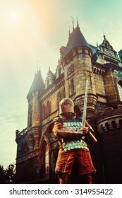 Medieval Knight With The Sword On The Ancient Castle Background