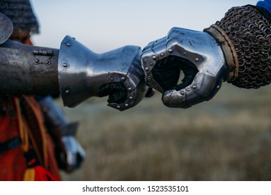 Medieval Knights Hands In Metal Gloves