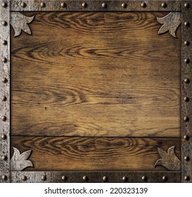 Medieval Metal Frame Over Old Wooden Background