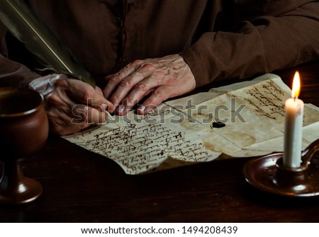 medieval Monk Hands write a letter