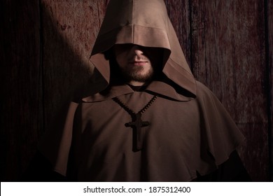 Medieval Monk Praying With Closed Eyes, With Wooden Cross On Neck