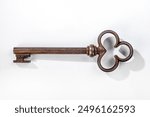 Medieval old key isolated with clipping path.
Rusty and heavy iron key of a door’s castle.
