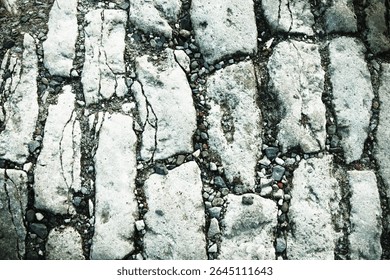 Medieval old stone cobblestone pavement background. Copy space for text or design.