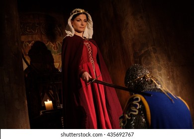 medieval-queen-doing-knighting-ceremony-260nw-435692767.jpg
