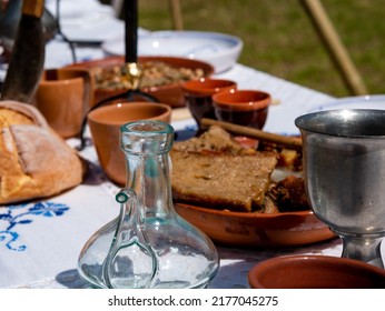 Medieval Reenactment - Table Set For Outdoor Medieval Dining In A Park During A Festival