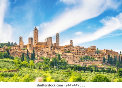 Medieval San Gimignano hill town with skyline of medieval towers, including the stone Torre Grossa. Province of Siena, Tuscany, Italy. - Powered by Shutterstock