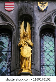 Medieval Statue at the Basilica of the Holy Blood in Bruges, of an Angel holding a shield with the Flemish Lion