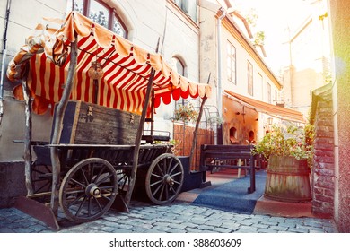 Medieval street and fragment of outdoors cafe in the old city of Riga, Latvia - Shutterstock ID 388603609