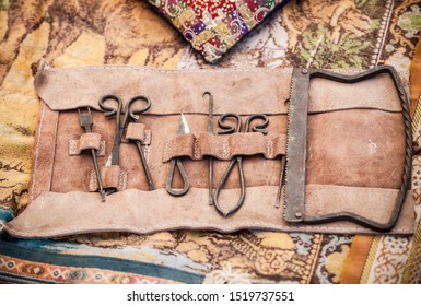 Medieval surgery doctors tools in leather wrap. Campaign surgical equipment