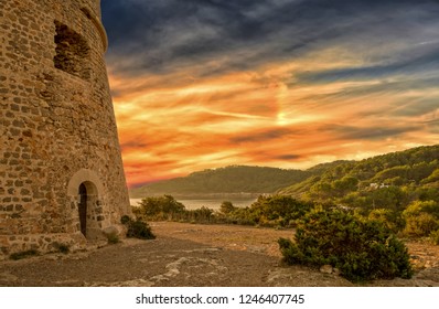Medieval tower of Sal Rossa at sunrise in Ibiza, Spain