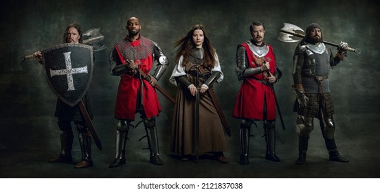 Medieval warriors. Creative art collage with brutal serious multiethnic knights in war clothes with wounded faces holding shield, sword isolated over vintage background. Comparison of eras, history
