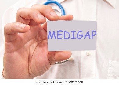 Medigap Written On The Doctor's Card. Medical Concept.