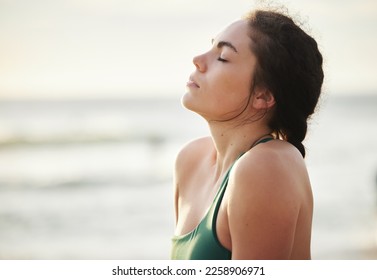Meditate, mockup and yoga by woman at the beach, sea and ocean for calm, peace and clear mind and soul. Zen, meditation and young female relax at shore for fitness, exercise and workout - Shutterstock ID 2258906971