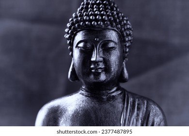 Meditating Buddha Statue on dark background. Soft focus. Close up. Copy space.                                                                                                                           - Powered by Shutterstock