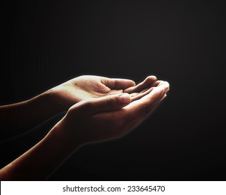 Meditation Concept: Muslim Prayer Open Two Empty Hands With Palms Up For Pray In Black Room Background
