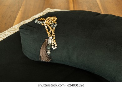 Meditation Cushion With Meditation Mala Neacklace.