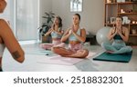 Meditation, health and class with women in studio for mindfulness, zen and wellness. Yoga balance, spiritual and healing aura with people and holistic practice for relax, awareness or energy