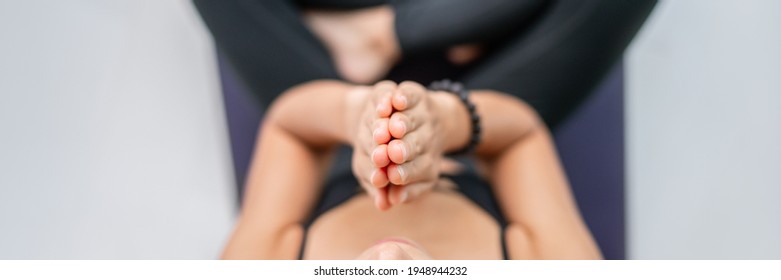 Meditation at home woman chanting mantra with prayer hands at mouth chakra saying zen prayer meditating at yoga class. Inner peace stress free mindfulness. Top view of person from above.