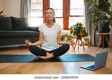 Meditation, Laptop And Elderly Woman Learning Zen Workout Online Tutorial In Living Room, Happy And Content. Fitness, Peace And Yoga For Beginner By Senior Female Enjoy Retirement Healthy Activity