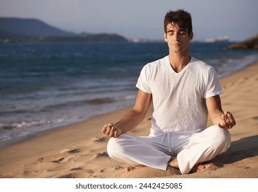 Meditation, lotus and man on beach, mindfulness and zen with fresh air for calm and eyes closed outdoor. Ocean, seashore and travel with yoga for health, peace of mind and holistic healing for aura - Powered by Shutterstock