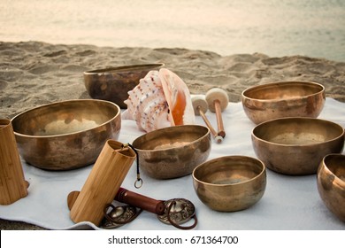 Meditation on the beach with Tibetan Singing bowls, Koshii and Tibetan tingshas. Balance and harmony. 