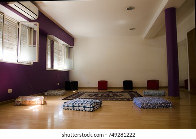 Meditation Room. Cushions On Wooden Floor And Arabic Rug.