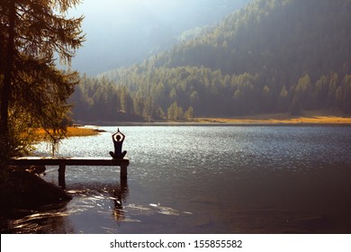 Meditation And Yoga Practicing At Sunset