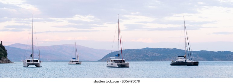 Mediterranean bay with sailing boats catamarans. Active lifestyle, travel destination, yachting, sailing, vacations, summer fun, enjoying life concept
