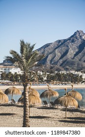 The mediterranean beach of Puerto Banus, Marbella, with La Concha peak in the background