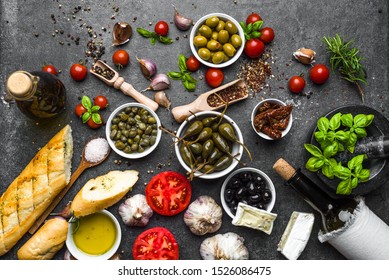 Mediterranean Food Background. Cooking Ingredients On Dark Slate.