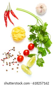 Mediterranean Food And Drink Healthy Diet: Fresh Vegetables Spices And Italian Herbs. Top View. Isolated On White. Cherry Tomatoes Parsley Lime Pasta Garlic Chili Peppers And Peppers