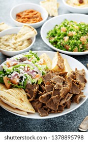 Mediterranean Food On The Table, Gyro Platter, Pita And Dips And Tabbouleh