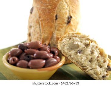 Mediterranean Olive Artisan Bread Table Shot Including Bowl of Olives and Shallow DoF       
