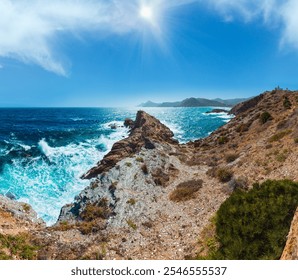 Mediterranean sea summer rocky coast view with unrecognizable man on cape and lighthouse El hoyo del faro (Portman, Costa Blanca, Spain). - Powered by Shutterstock