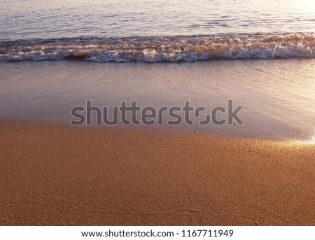 The Mediterranean Sea at the sunset, waves at sunset, Greece