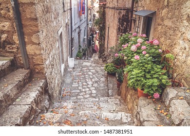 Mediterranean summer cityscape - view of a medieval street with stairs in the Old Town of Dubrovnik on the Adriatic Sea coast of Croatia - Powered by Shutterstock