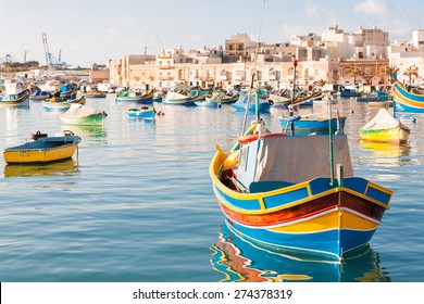 Mediterranean traditional colorful boats luzzu  Fisherman village in the south east Malta  Early winter morning in Marsaxlokk  Malta 