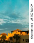 Mediterranean villa with terracotta roof illuminated by sunset in Calahonda, Costa del Sol, Spain, with clear skies above