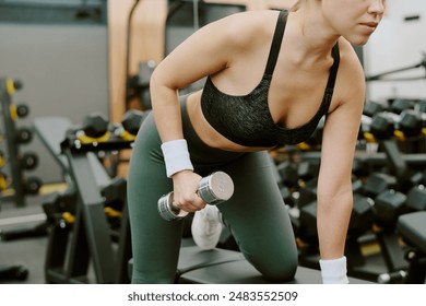 Medium close up of female body doing exercise for shoulder and back muscles - Powered by Shutterstock