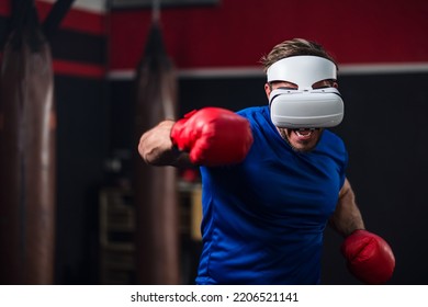 Medium Close Up And Motion Blur Of Sport Man Wearing VR Headset To Exercise With Simulation Boxing Games, Young Man Athlete Boxer Virtual Reality Combat Experience Activity. New Experience Lifestyle.