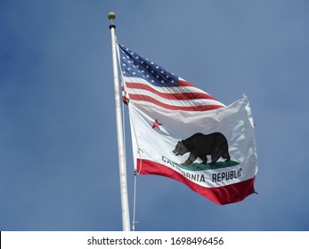 Medium Close Up Shot Of The State Of California Flag Flying From A Pole, Cropped Shot. 