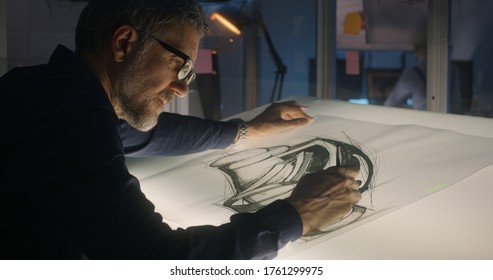 Medium Close-up Of A Male Car Designer Drawing Concept Art