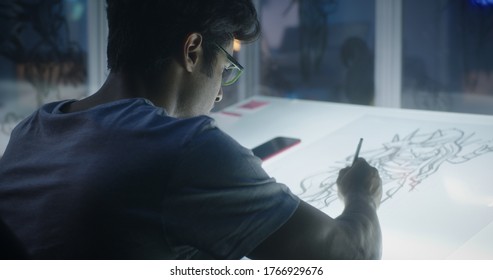 Medium Close-up Of A Young Graphic Designer Drawing Concept Art For Video Game