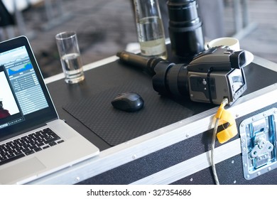 medium format professional photo camera connected to laptop computer in photography studio