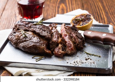 Medium Rare Grilled Marinated Beef Flank Steak On Silver Plate