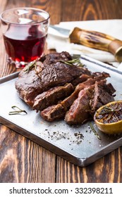 Medium Rare Grilled Marinated Beef Flank Steak On Silver Plate