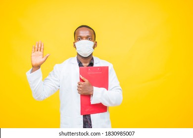 Medium Short Of An African America Doctor Holding His Patient Report.