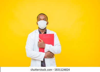 Medium Short Of An African America Doctor Holding His Patient Report.